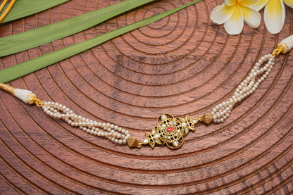 MOTHER OF PEARL, GOLD PLATED SILVER CENTRE , STRUNG IN PEARLS