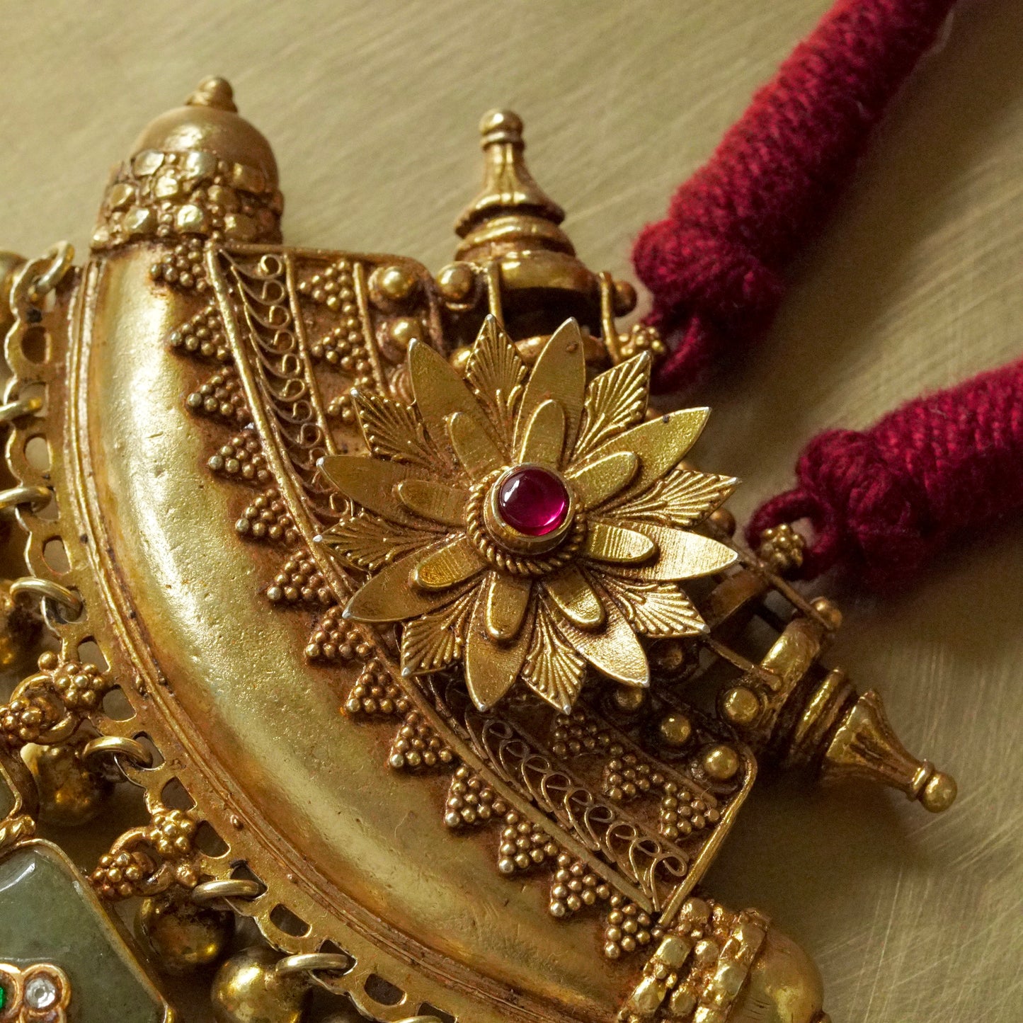 ORN062 Gold Plated 92.5 Silver sun Amulate with green gemstone tusks Pendant