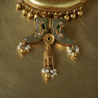 Sun Amulate with green gemstone tusks Pendant